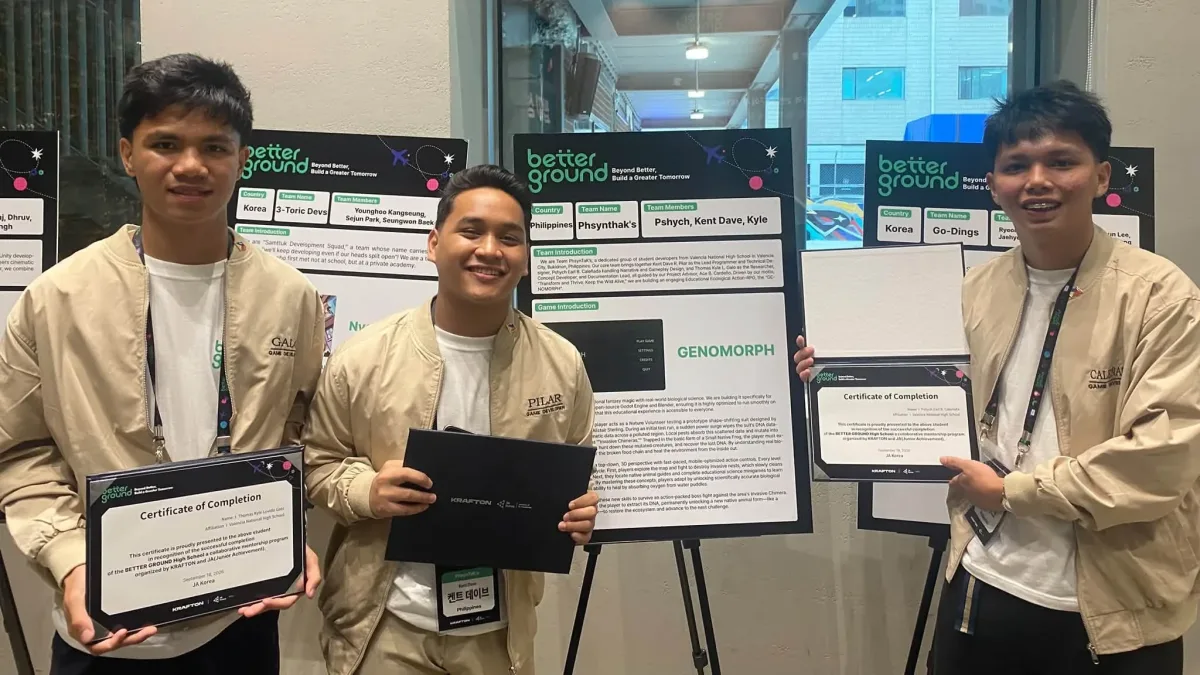 Valencia National High School student game developers Thomas Kyle Galo, Kent Dave Pilar, and Pshych Earl Caleñada present their mobile game GENOMORPH alongside project advisor Ace B. Cardeño's team display at Krafton's BETTER GROUND 2026 event in Seoul, South Korea. (Photo courtesy of Ace Cardeño)