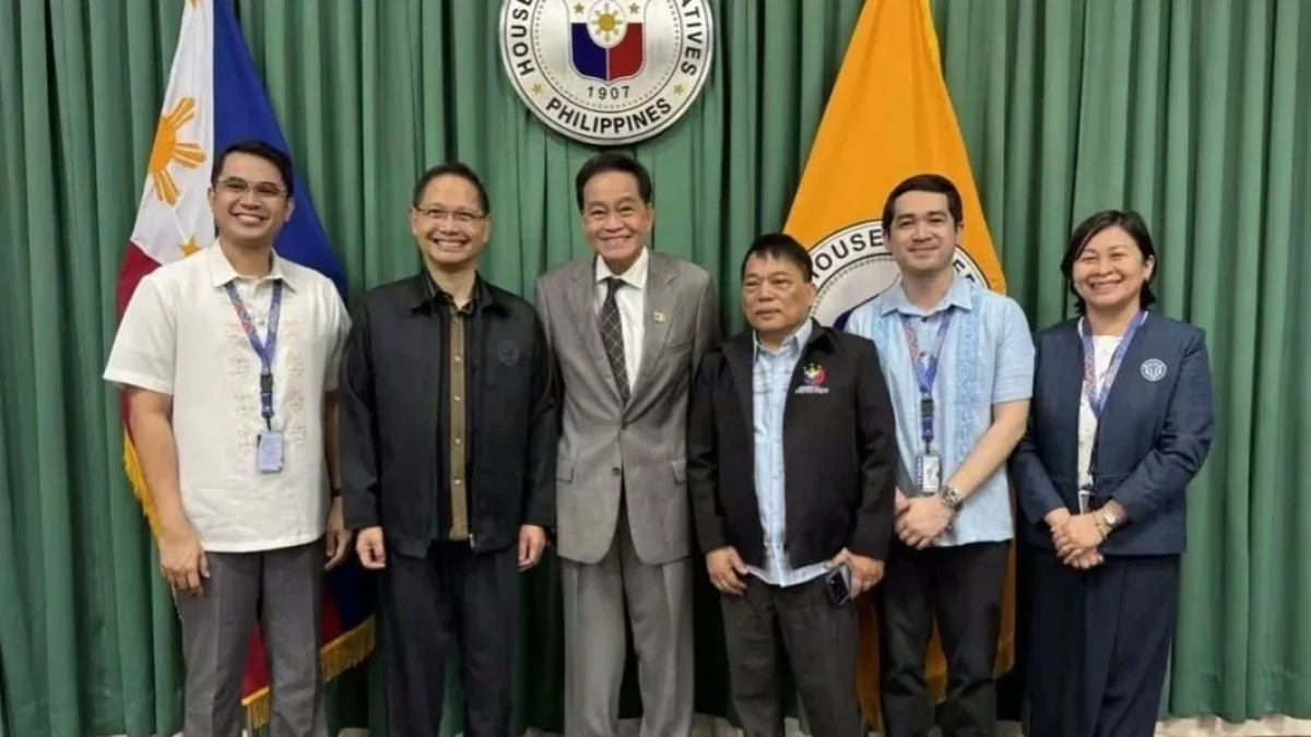 ABAMIN Party-list Representative Maxie Rodriguez, TESDA Administrator Kiko Benitez, and other officials pose for a group photo in front of the House of Representatives seal.