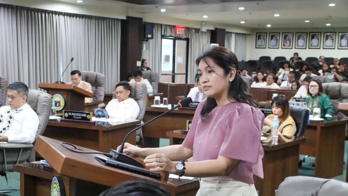 Cagayan de Oro City Councilor Yevonna Yacine Emano speaking at the podium inside the city council session hall during debates over the proposed ₱8.5-billion Government Complex loan.
