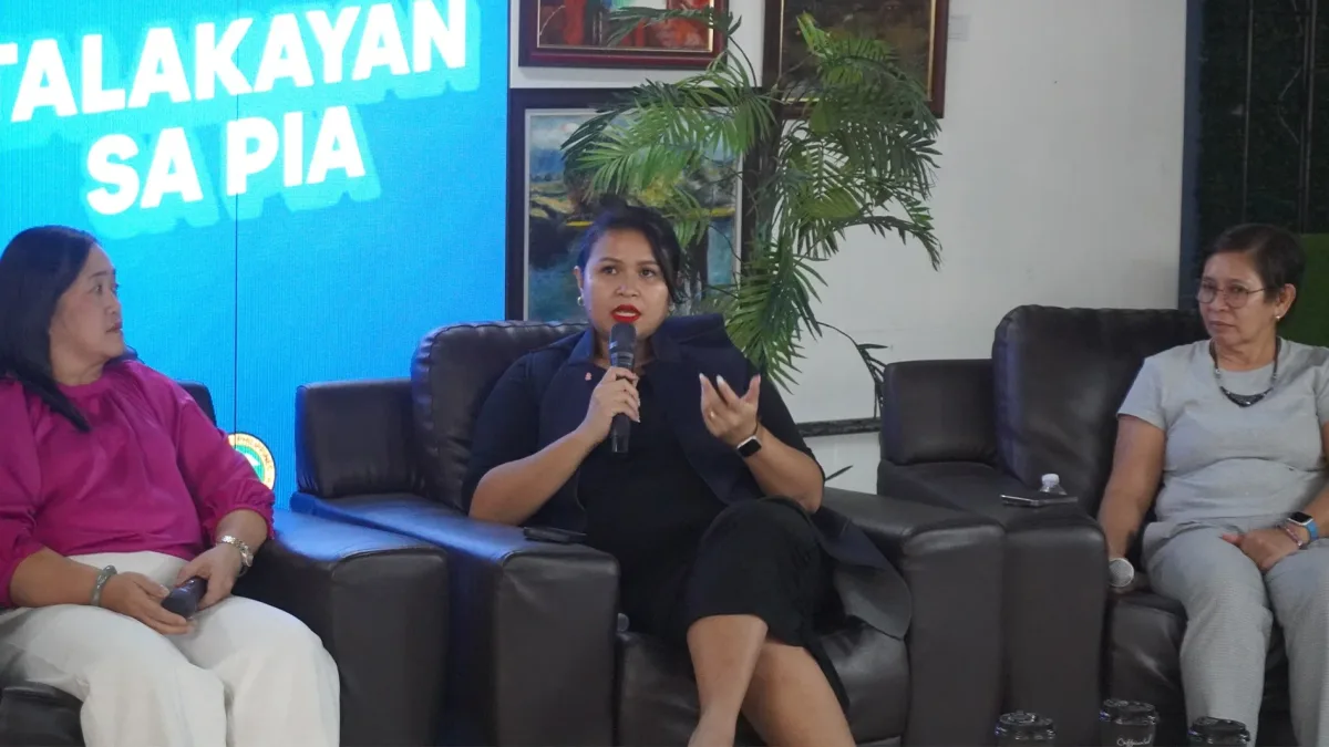Dr. Steffi Grace H. Enon of DOH-CHD Northern Mindanao speaks into a microphone during the Talakayan sa PIA media forum in Cagayan de Oro City, sharing her personal journey as a Stage 0 breast cancer survivor to advocate for early screening.