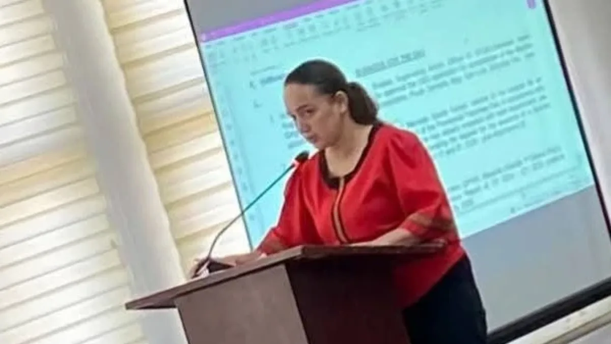 Gingoog City Councilor Stephanie Marie L. Kho speaks at a podium inside the Sangguniang Panlungsod session hall during a local legislative hearing on housing ordinance amendments.