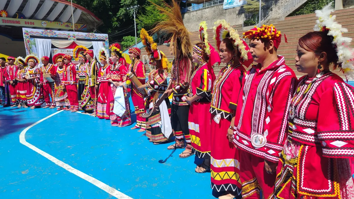 Members of the indigenous Higaonon tribe wearing traditional red attire stand in line during the Kaamulan Ta Bayug Iligan City Festival in Iligan City.