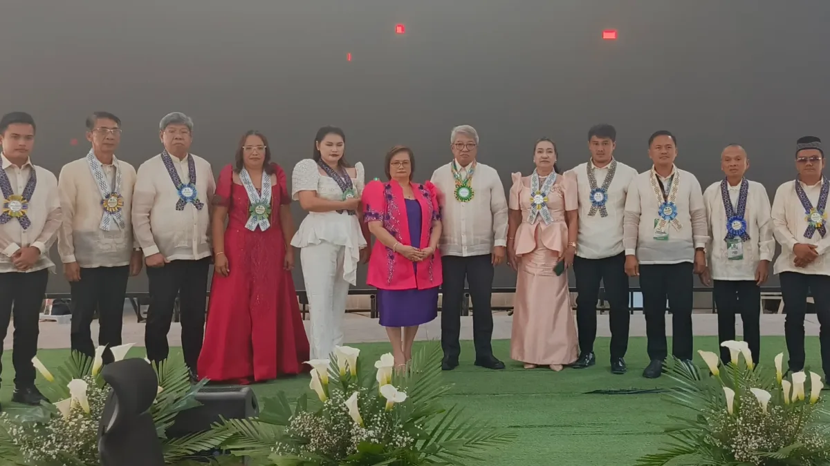 Mayor Sonia A. Arnado, Vice Mayor Rommel C. Arnado, and municipal council members pose on stage in formal Filipiniana and Barong Tagalog during the joint State of the Municipality Address and State of the Legislature Address at the Kauswagan International Organic Convention Center.