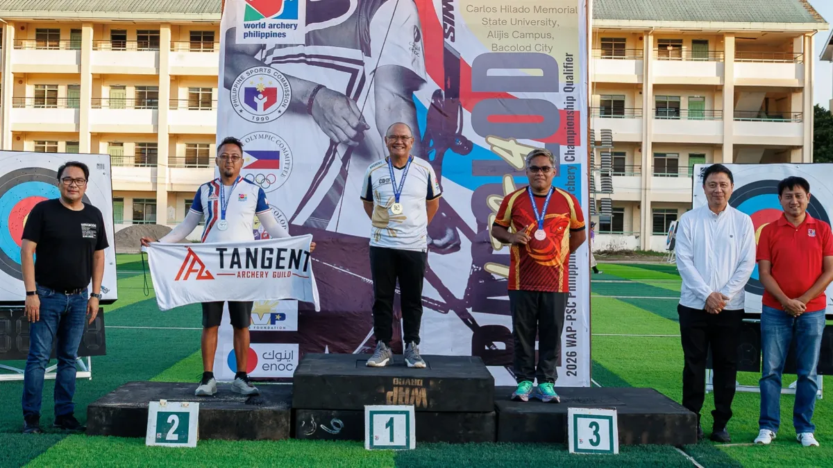 National archer Kenneth Marlowe Adecer Tan stands atop the podium after winning both gold medals in the Barebow Men's division as World Archery Philippines and Philippine Sports Commission officials lead the awarding ceremony in Bacolod City.