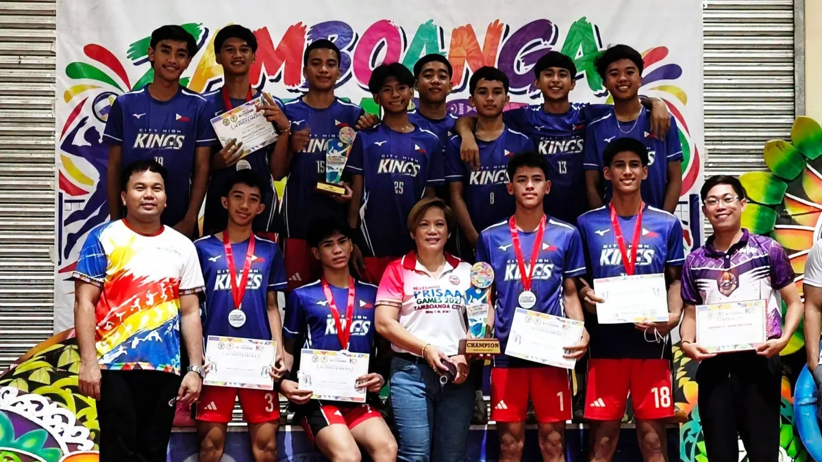 Members and coaches of the Kidapawan City National High School City High Kings pose with their championship trophy, medals, and individual award certificates during the Zamboanga Hermosa Volleyball Tournament 2026.