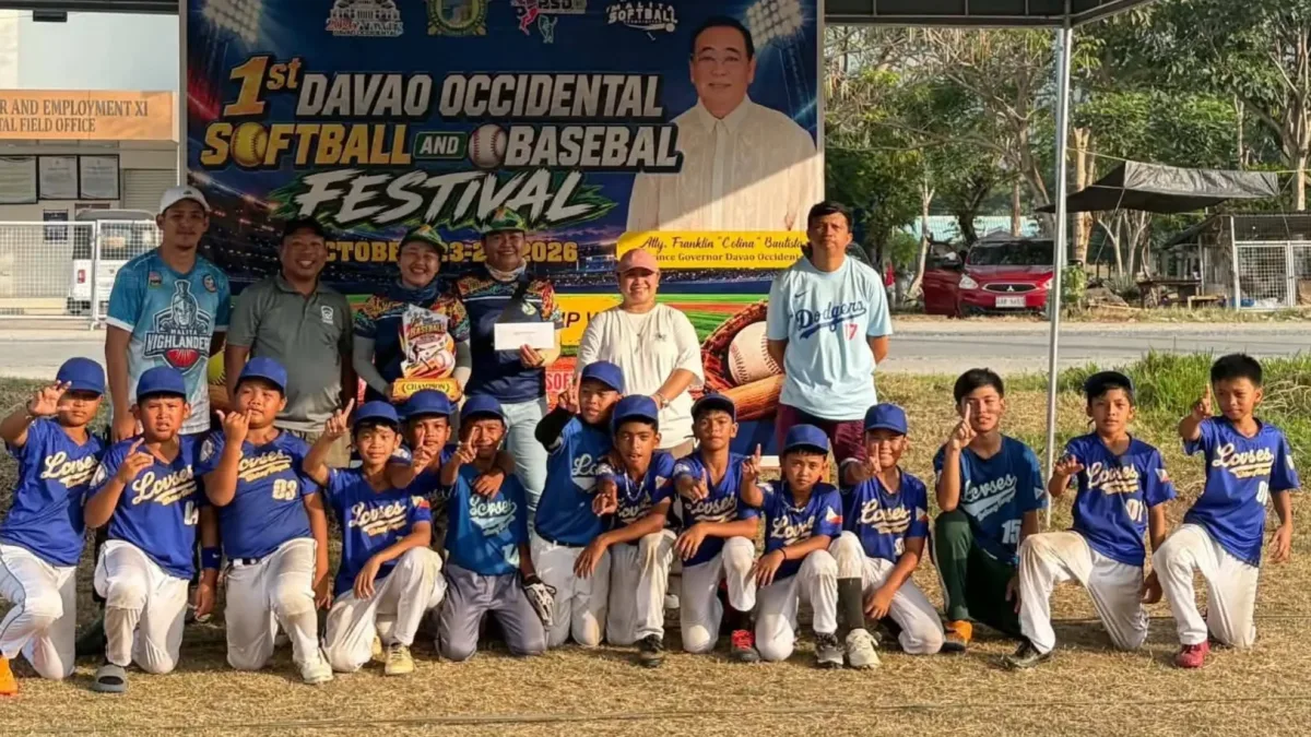 Student-athletes and coaches of the Lt. Cipriano Villafuerte Sr. Elementary School baseball team from Davao City pose for a group photo in front of the 1st Davao Occidental Softball and Baseball Festival backdrop in Malita, Davao Occidental.