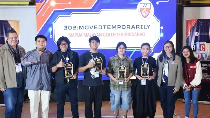 Members of Mapúa Malayan Colleges Mindanao's Team 302: MovedTemporarily standing on stage holding champion trophies alongside their faculty mentor and DICT Region 11 officials during the 2026 HackF5RGov competition.