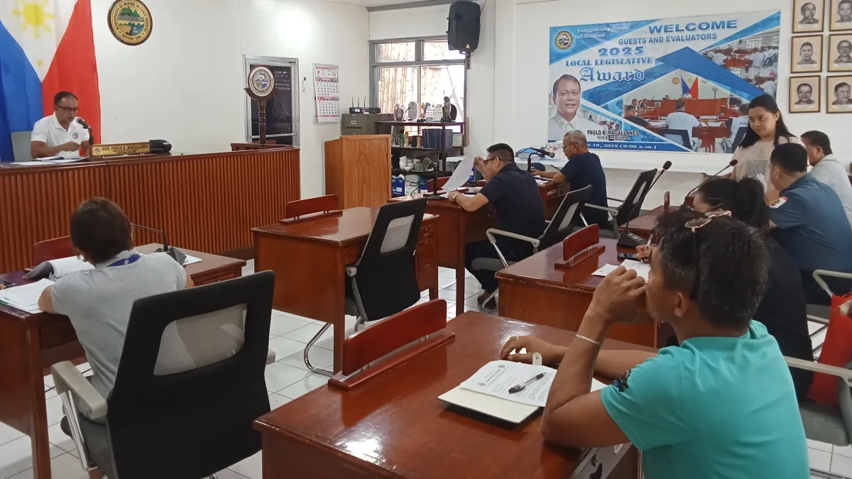 Members of the Medina Sangguniang Bayan Committee on Transportation and Public Safety convene in the session hall during a meeting chaired by Councilor Esmael Naguib Jr. to discuss driver regulations, passenger complaints, and municipal traffic signage.