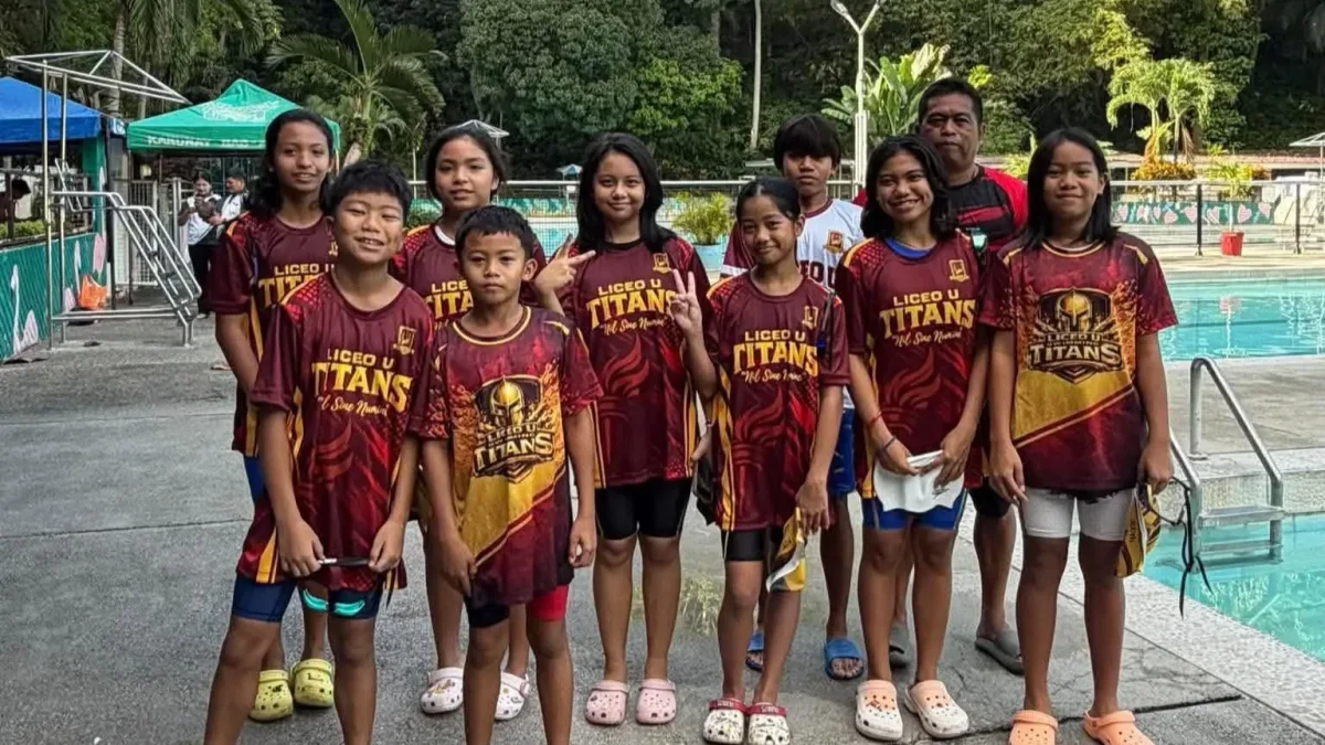 Young student-athletes of the Liceo Titans swimming squad and head coach Arvin Parajes pose poolside in maroon and gold Liceo U Titans jerseys at the Kagay-an Lawndale Spring Resort.