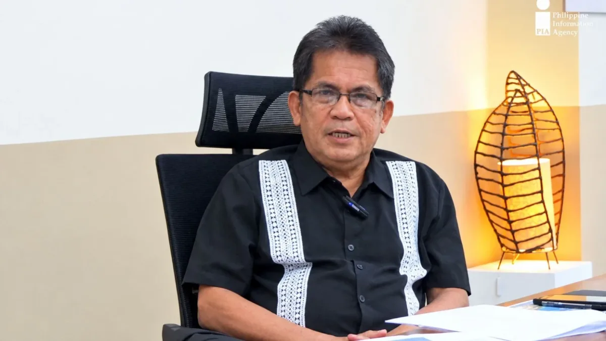 Oro Chamber President Almarco C. Brito sits at a desk during an interview discussing ASEAN trade opportunities and export readiness for Northern Mindanao MSMEs.
