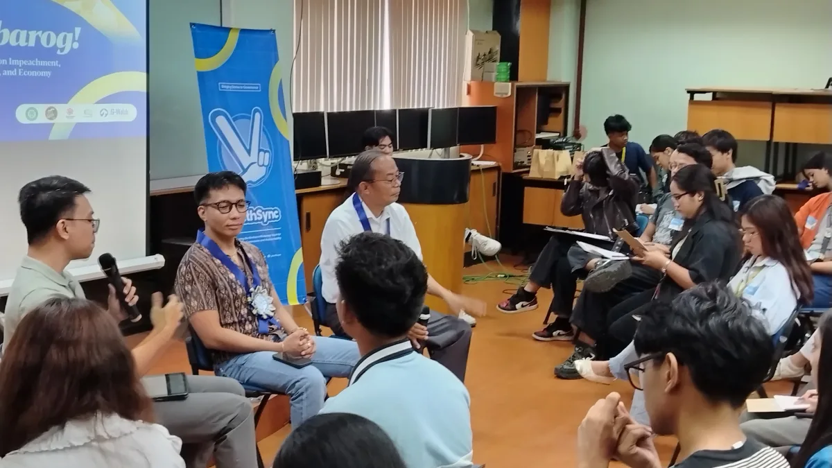 Students, youth leaders, and resource speakers gather in a panel circle during the "Pag Barog Forum on Impeachment, Corruption, and the Economy" at Xavier University in Cagayan de Oro City.