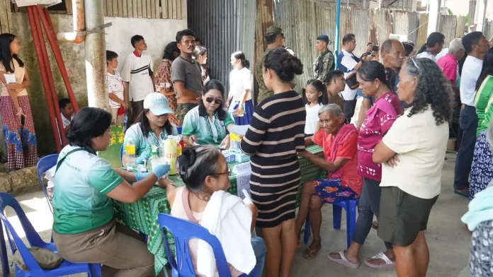 Medical staff and provincial health workers conduct blood pressure and health screenings for elderly residents and Indigenous Peoples of Barangay Lubilan during the Panaghiusang Serbisyo outreach led by Misamis Oriental Governor Juliette Uy in Naawan town.