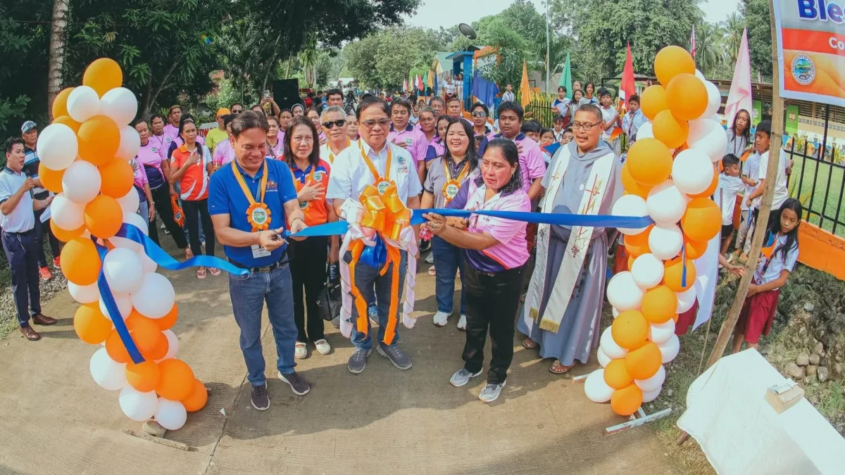 Plaridel Mayor Gadwin E. Handumon, Punong Barangay Nymfa D. Salik, and DILG Misamis Occidental Provincial Director Edward G. Bhagwani cut the ceremonial ribbon for the new farm-to-market road in Barangay Cartagena Proper.