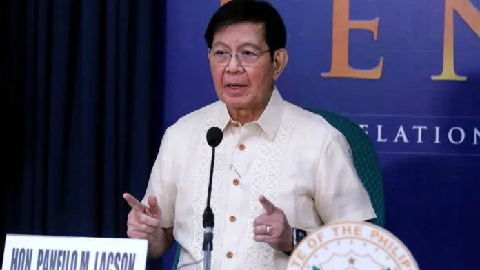 Sen. Panfilo "Ping" Lacson gestures while speaking at a press conference microphone in front of a Senate of the Philippines backdrop.