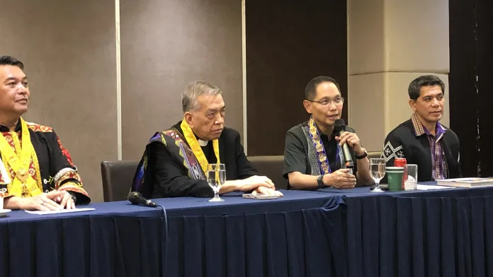 TESDA Director General Secretary Kiko Benitez speaks at a press panel table alongside MinTVET officials during a news conference in Cagayan de Oro City.