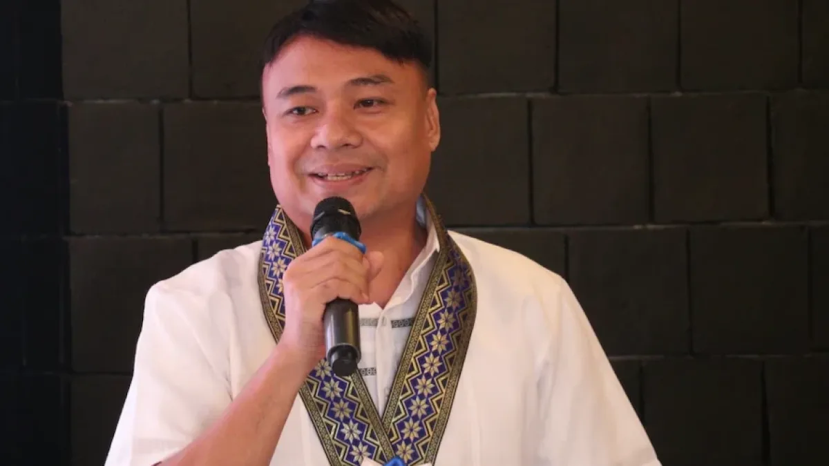 Misamis Occidental Provincial Planning and Development Coordinator William I. Valles Jr. speaks at a podium during the Philippine Statistics Authority's Provincial Product Accounts Data Dissemination Forum.