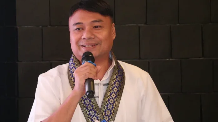 Misamis Occidental Provincial Planning and Development Coordinator William I. Valles Jr. speaks at a podium during the Philippine Statistics Authority's Provincial Product Accounts Data Dissemination Forum.